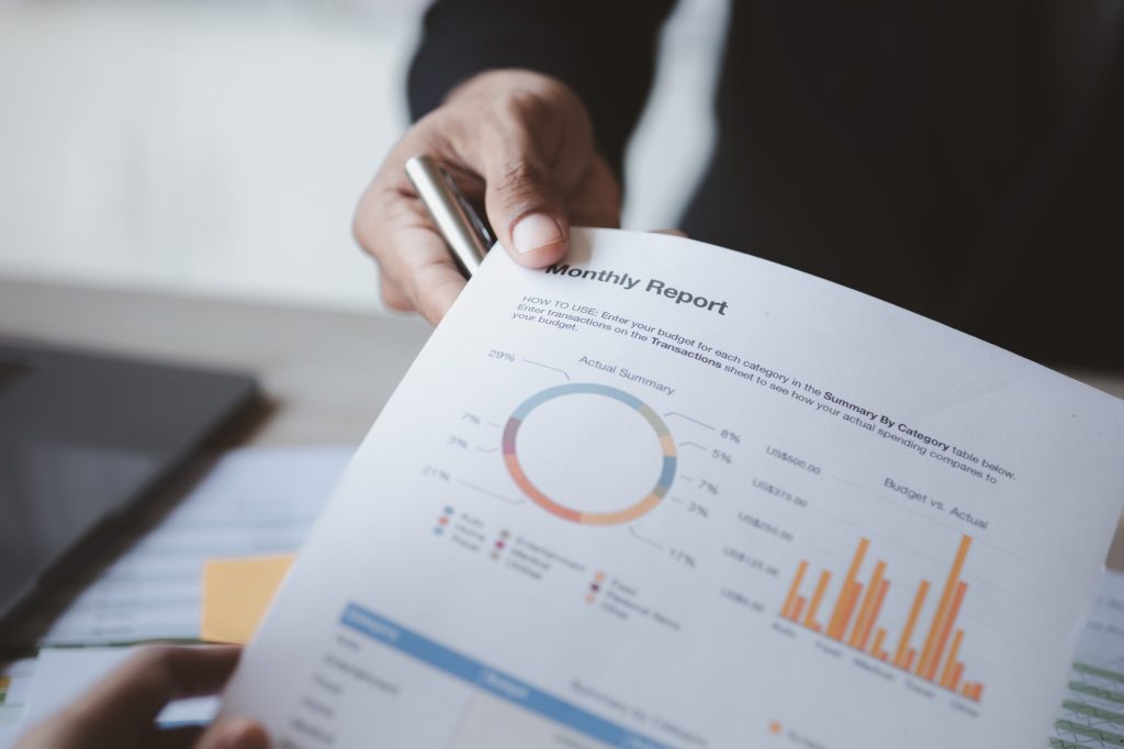 Two businessmen looking together at business documents.