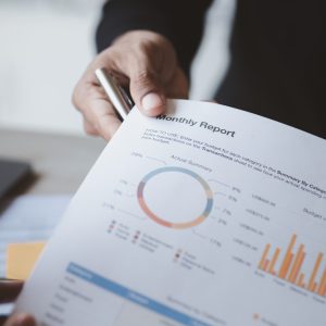Two businessmen looking together at business documents.
